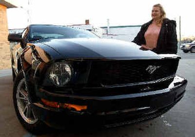 
Deanna Adams of Detroit, looks at a new Ford Mustang in St. Clair Shores, Mich., on Wednesday,. 
 (Associated Press / The Spokesman-Review)