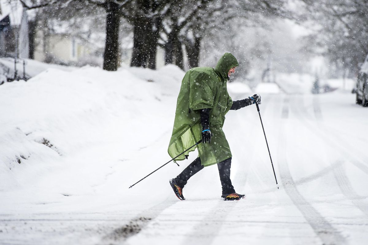 Brett McKusick crosses Maple Street at 14th Avenue during his training hike, Tuesday morning, Feb. 21, 2017, in Spokane, Wash. McKusick is headed for the Appalachian Trail to begin his 2200 mile trek on Feb. 26 and hopes to complete the journey through 14 states on July 1. (Dan Pelle / The Spokesman-Review)