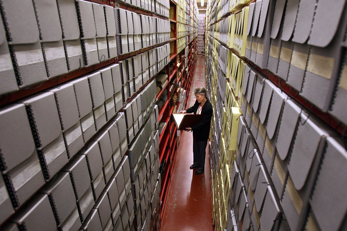 In this Oct. 9, 2009 photo, Susan Karren (cq) Regional Archives Director for the Seattle Branch of the National Archives and Records Administration, in one of the aisles of the archival stacks.  (Greg Gilbert/The Seattle Times)