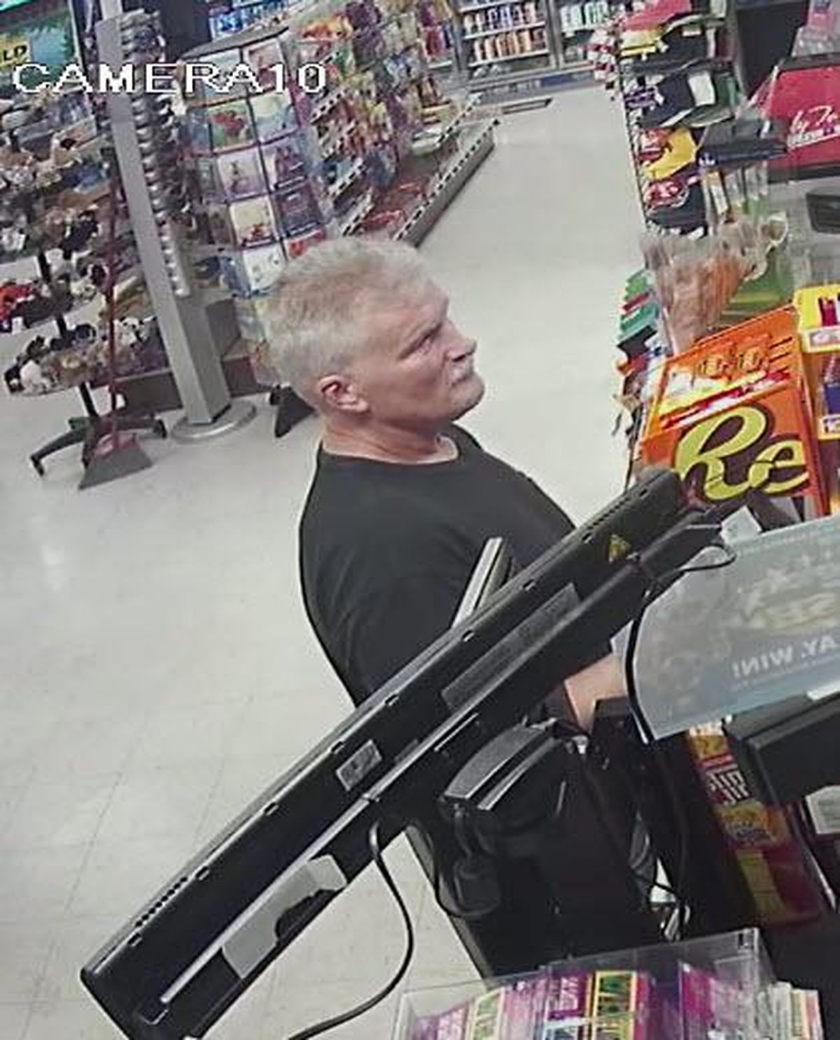 A man with gray hair and a mustache has been identified as a person of interest in robberies across four states. (Photo courtesy of North Greenbush police department)