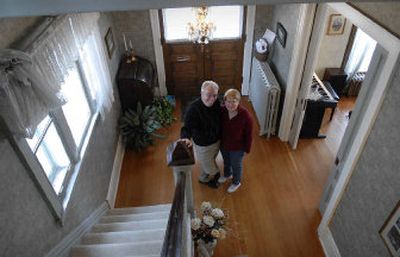 
The Jamisons stand in the entryway of their Queen Anne home. 
 (Dan Pelle / The Spokesman-Review)