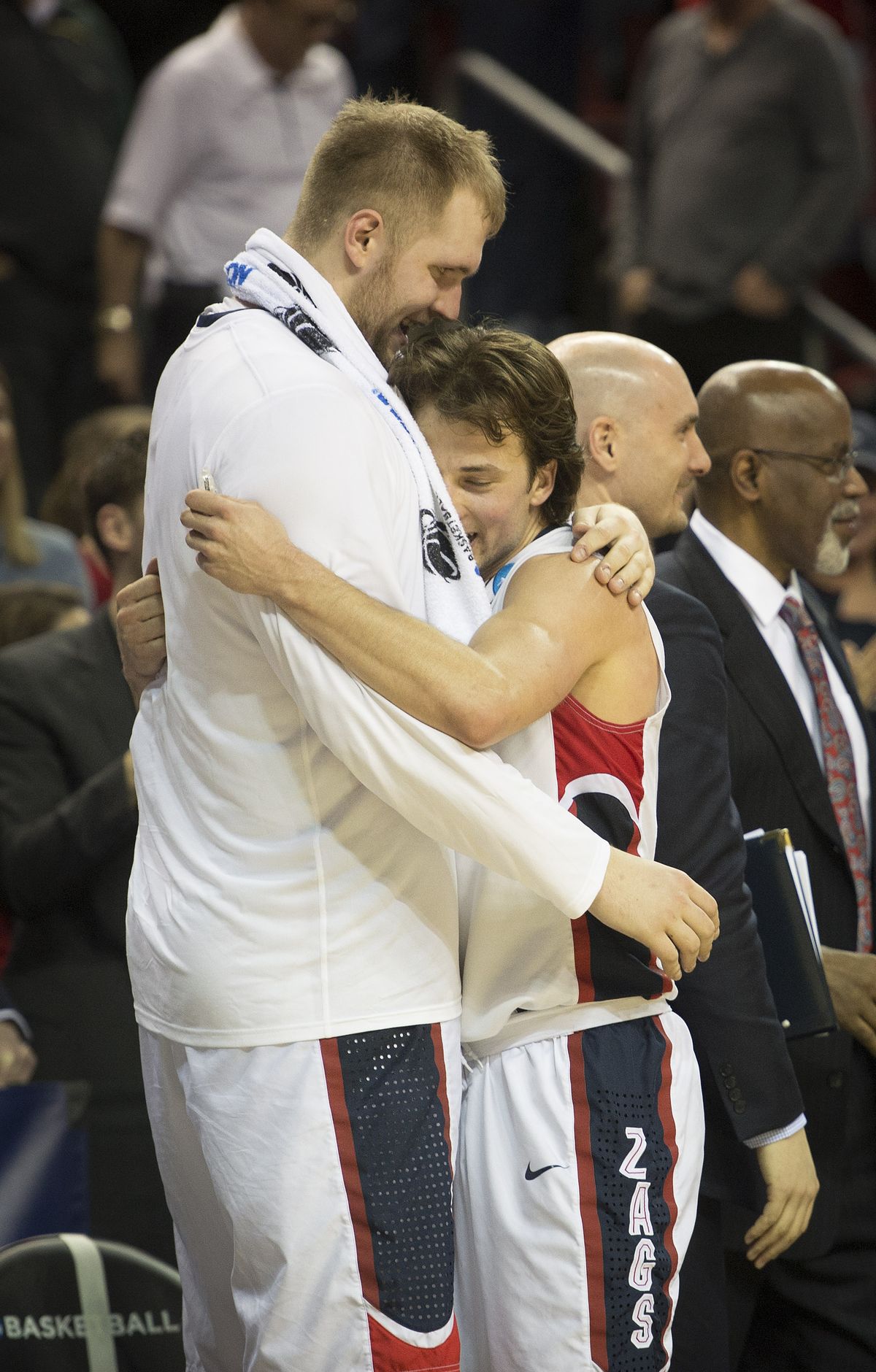 Kevin Pangos, right, hugs teammate Przemek Karnowski after leaving court. (Colin Mulvany)