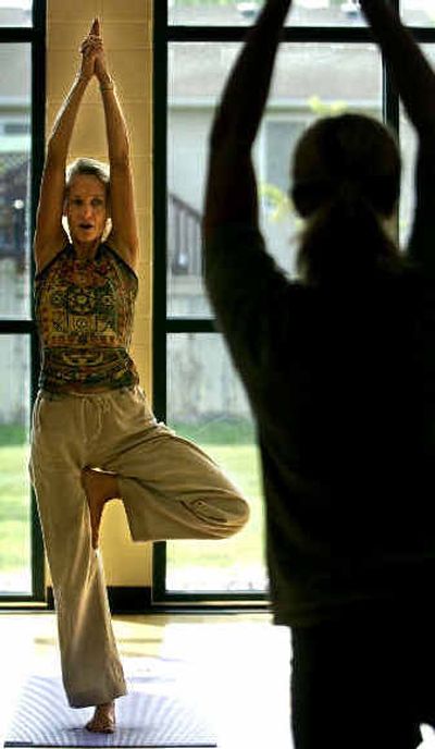 
Barb Oviatt teaches a yoga class at the Liberty Lake Sporting Club. 
 (File/ / The Spokesman-Review)