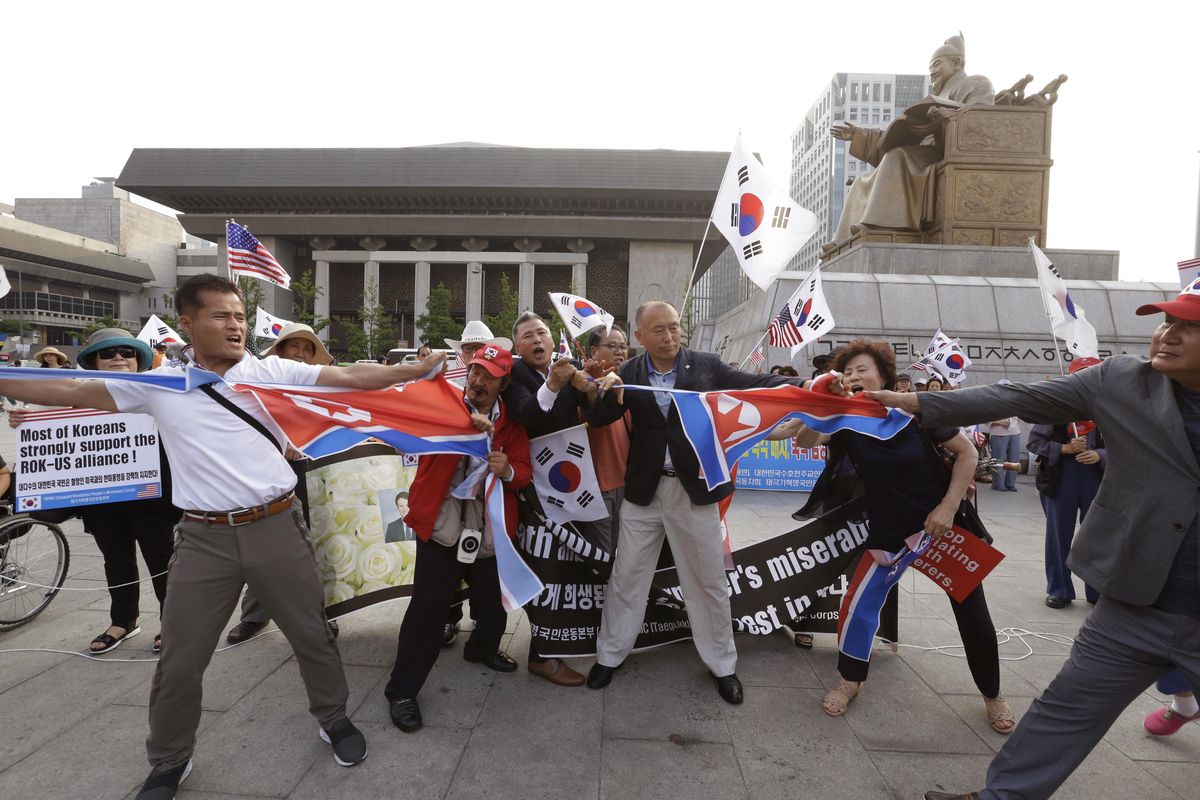 South Korean protesters against North Korea tear North Korean flags up during a rally supporting the deployment of an advanced U.S. missile defense system called Terminal High-Altitude Area Defense, or THAAD, near the U.S. Embassy in Seoul, South Korea, Thursday, June 29, 2017. South Korean President Moon Jae-in vowed Wednesday to stand firmly with President Donald Trump against North Korea, playing down his past advocacy of a softer approach toward the nuclear-armed nation as he made his first visit as president to Washington. (Ahn Young-joon / AP)