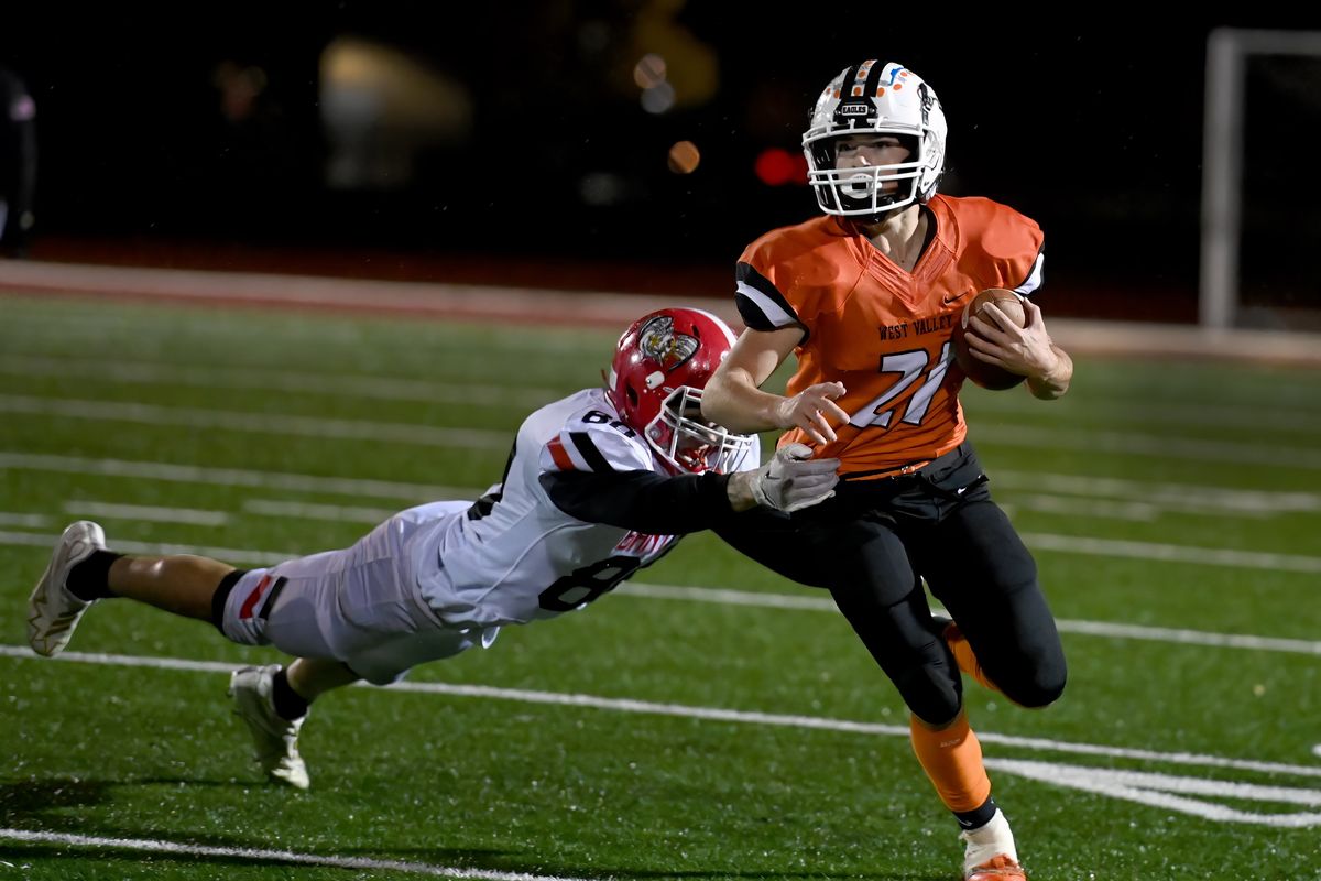 West Valley running back Judah Clark breaks away from a defender during a GSL 2A football tiebreaker on Tuesday, Nov. 1, 2022 at University High School.  (COLIN MULVANY/THE SPOKESMAN-REVIEW)
