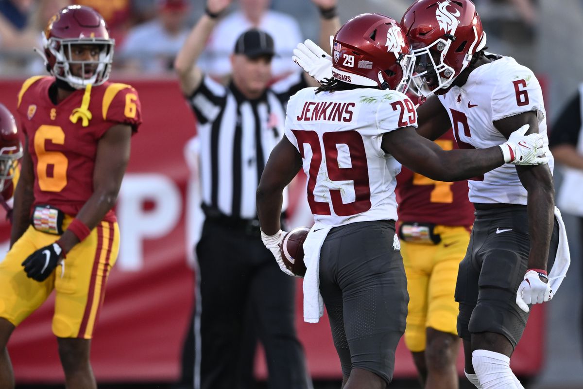 Washington State running back Jaylen Jenkins celebrates with wide receiver Donovan Ollie after Jenkins caught a long pass against USC on Saturday at Los Angeles Memorial Coliseum.  (Tyler Tjomsland/The Spokesman-Review)