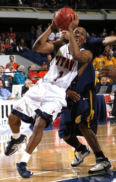 
Cal State Fullerton's Josh Akognon, left, began his career at WSU.Associated Press
 (Associated Press / The Spokesman-Review)