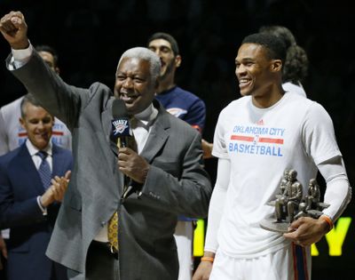 Oklahoma City Thunder guard Russell Westbrook, right, is congratulated by Oscar Robertson, left, on his triple-double record, before an NBA basketball game between the Denver Nuggets and the Thunder in Oklahoma City, Wednesday, April 12, 2017. (Sue Ogrocki / Associated Press)