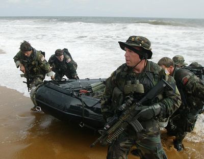 American Navy Seals land on the main beach in Monrovia, Liberia in this Aug. 18, 2003 file photo. (Schalk van Zuydam / AP)