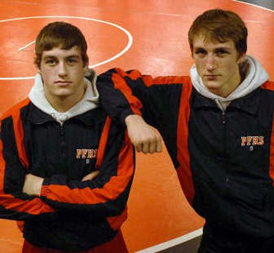 
Wrestling cousins Danny and Ryan Booth pile up wins for Post Falls.
 (The Spokesman-Review)