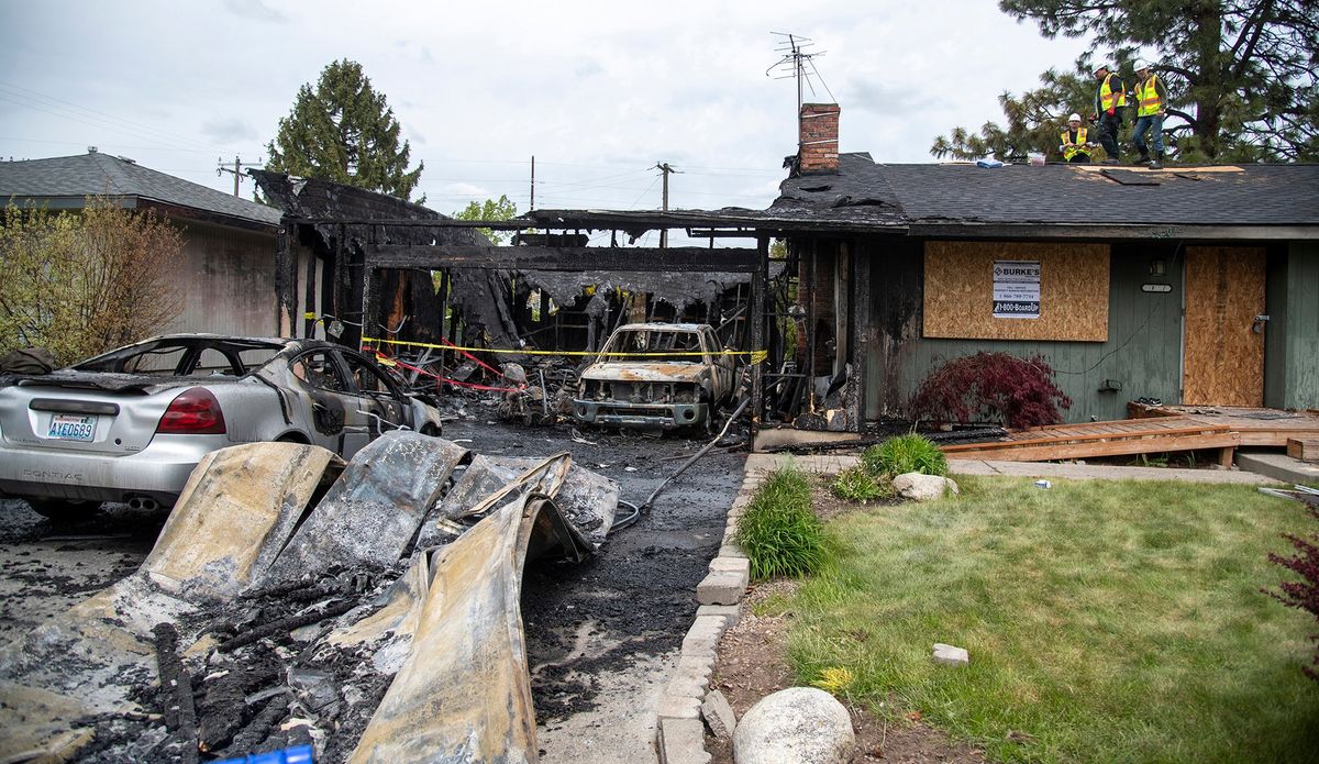 The home at 11509 E. Frederick Avenue, near Bowdish Road, burned overnight and is shown Tuesday morning heavily damaged from the overnight fire.  (Jesse Tinsley/The Spokesmman-Review)