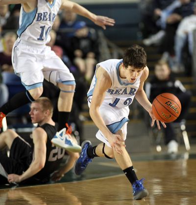 Central Valley's Adam Chamberlain, right, heads up court after stealing the ball from Union's Brian Cairns during action in the 4A Boys State Basketball Tournament Friday.   (Patrick Hagerty / The Spokesman-Review)