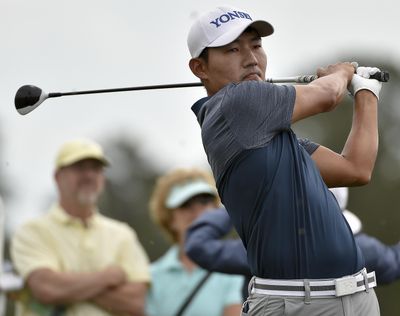 Sung Kang watches his tee shot on the third hole during the third round of the Houston Open on Saturday. Kang leads by three shots entering Sunday’s final round. (Eric Christian Smith / Associated Press)