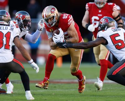 San Francisco 49ers’ George Kittle runs after a catch against the Tampa Bay Buccaneers in the second quarter at Levi’s Stadium in Santa Clara, Calif., on Sunday.  (Tribune News Service)