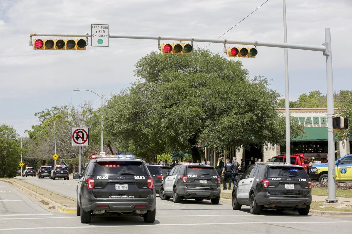 Austin police, SWAT and medical personnel respond to an active shooter situation located Great Hills Trail in Northwest Austin, Texas, on Sunday, April 18, 2021. Emergency responders say several people have been fatally shot in Austin and that no suspect is in custody.  (Brontë Wittpenn)