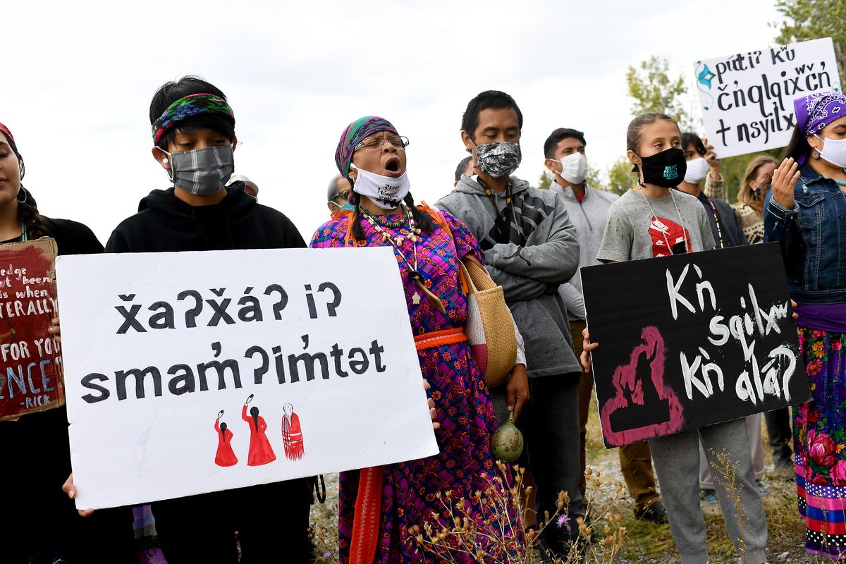 Virginia Redstar, center, with the River Warrior Society sings as she joins Colville Confederated Tribe members and supporters at the Boundary-Waneta Border Crossing in support of Rick Desautel's case in the Canadian Supreme court arguing for the Sinixt peoples' right to hunt traditional lands in Canada on Thursday, October 8, 2020, near Northport, Wash. Desautel, a member of Lakes Tribe of the Colville Confederated Tribes, shot a cow elk in British Columbia in 2010 to assert the Sinixt people's rights to hunt the traditional lands and to challenge a Canadian declaration 60-years-ago that the Sinixt people were extinct.  (Tyler Tjomsland/THE SPOKESMAN-REVIEW)