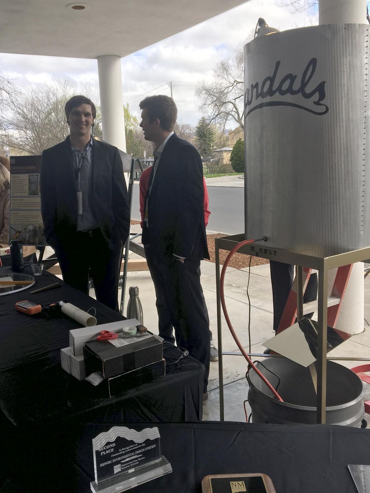 Eric Hill, left, and James Rockwell with a scale model prototype of a system to clean sediment from a University of Idaho water storage tank. (Peter Harriman / Peter Harriman/For The Spokesman-Review)