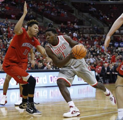 Ohio State’s Jae’Sean Tate drives the lane against Northeastern’s Jeremy Miller. (Jay Laprete / Associated Press)