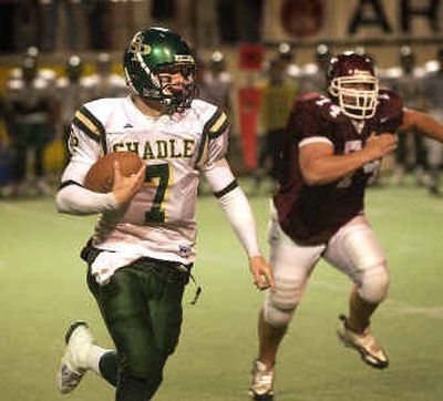 
Shadle Park QB Josh Powell, here in action against North Central this year, has a great arm, but also ran for five TDs last season.
 (The Spokesman-Review)