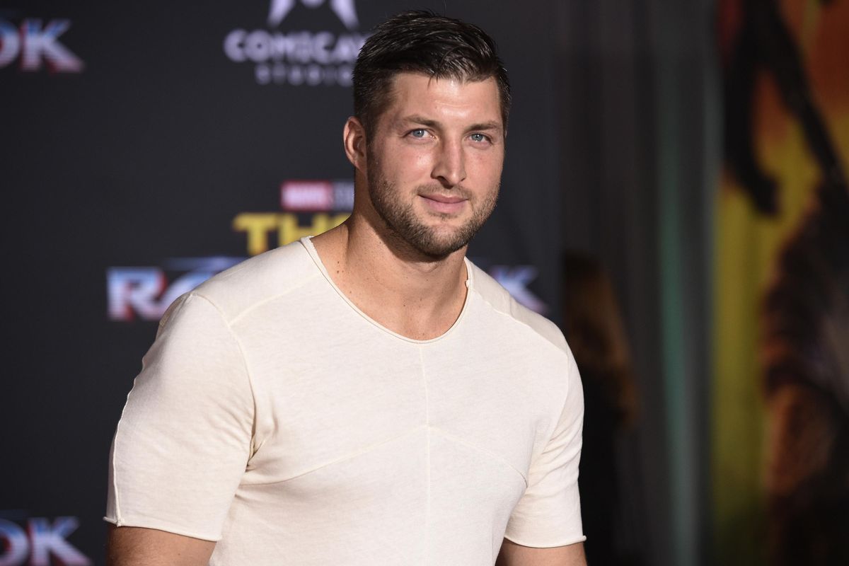 In this Tuesday, Oct. 10, 2017  photo, Tim Tebow arrives at the world premiere of “Thor: Ragnarok” at the El Capitan Theatre in Los Angeles. the former Denver Broncos and University of Florida quarterback is engaged. The Heisman Trophy winner announced his engagement on Instagram Thursday, Jan. 10, 2019 to Demi-Leigh Nel-Peters, a South Africa native and the 2017 Miss Universe. (Chris Pizzello / Invision/Associated Press)