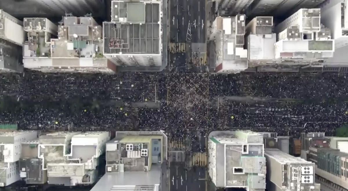 In this image from video and taken with a drone, protesters fill the Hennesy Road in Hong Kong on Sunday. (Associated Press)