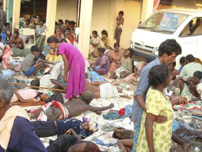 Ethnic Tamil victims of a shelling attack wait outside a hospital in Mullivaaykaal, Sri Lanka, Sunday.  (Associated Press / The Spokesman-Review)