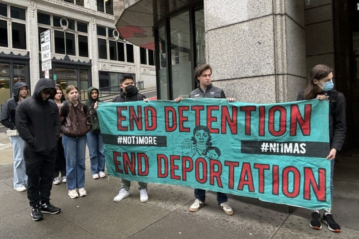 Advocates call for the closure of Northwest ICE Processing Center outside of ICE’s Seattle field office Thursday.  (Grace Deng/Washington State Standard)