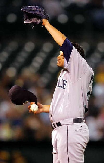 
Joel Pineiro couldn't make it out of the fourth inning. 
 (Associated Press / The Spokesman-Review)