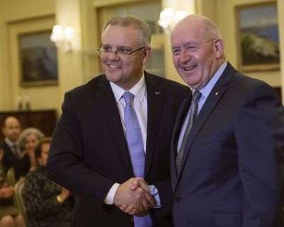 New Australian Prime Minister Scott Morrison, left, is congratulated by the Governor General Sir Peter Cosgrove after been sworn in at Government House in Canberra, on Friday, Aug. 24, 2018. (Andrew Taylor / AP)