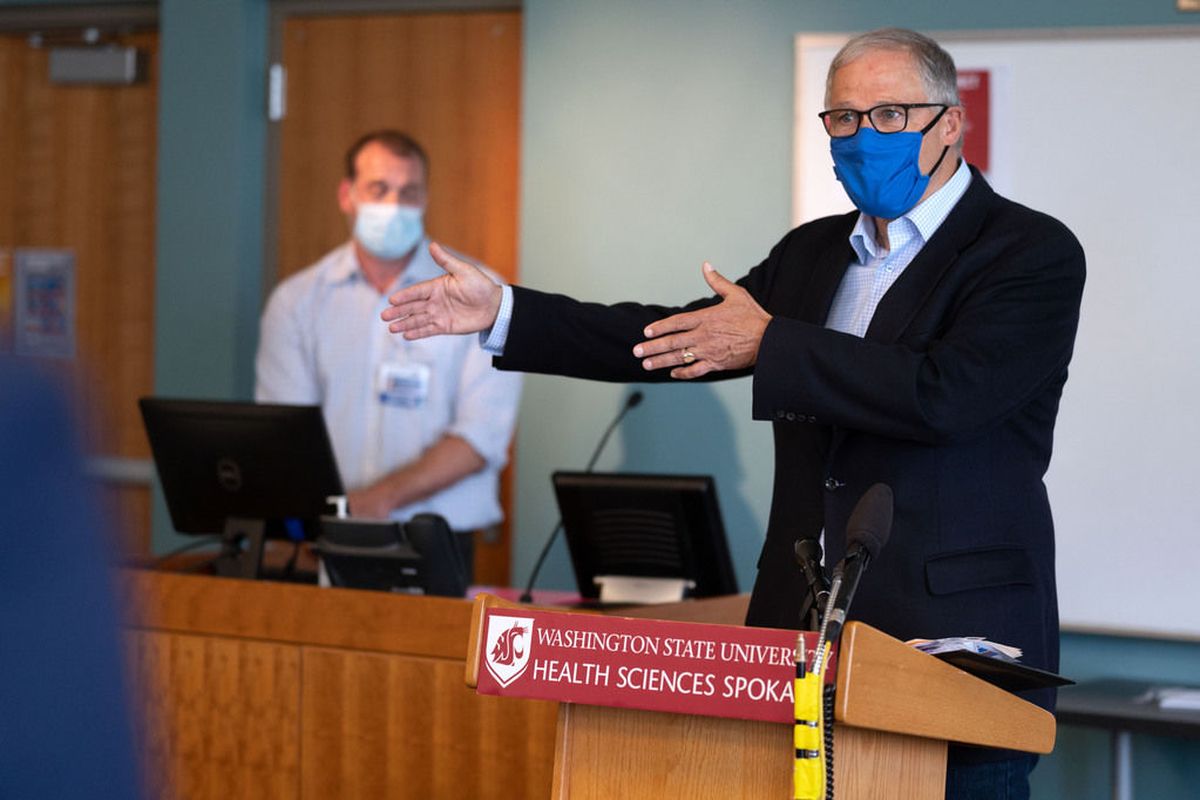 Gov. Jay Inslee meets with the press on Thursday, in the WSU Spokane Pharmaceutical & Biomedical Sciences Building. As COVID-19 infection and hospital rates rise, Gov. Inslee said, “Spokane is right on the verge of a very dire situation.”  (Colin Mulvany/THE SPOKESMAN-REVIEW)