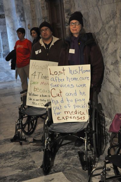 OLYMPIA--Members of the SEIU protest proposed budget cuts outside the governor's office on 12/15/2010. (Jim Camden/The Spokesman-Review)