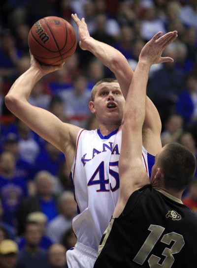 Kansas center Cole Aldrich is one Jayhawk who would like to beat North Carolina to 2,000 overall wins.  (Associated Press)