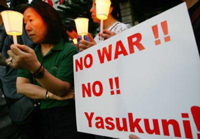 
Protesters rally  Saturday in Tokyo  against the Yasukuni  shrine, reviled by  some for glorifying Japan's military past. 
 (Associated Press / The Spokesman-Review)