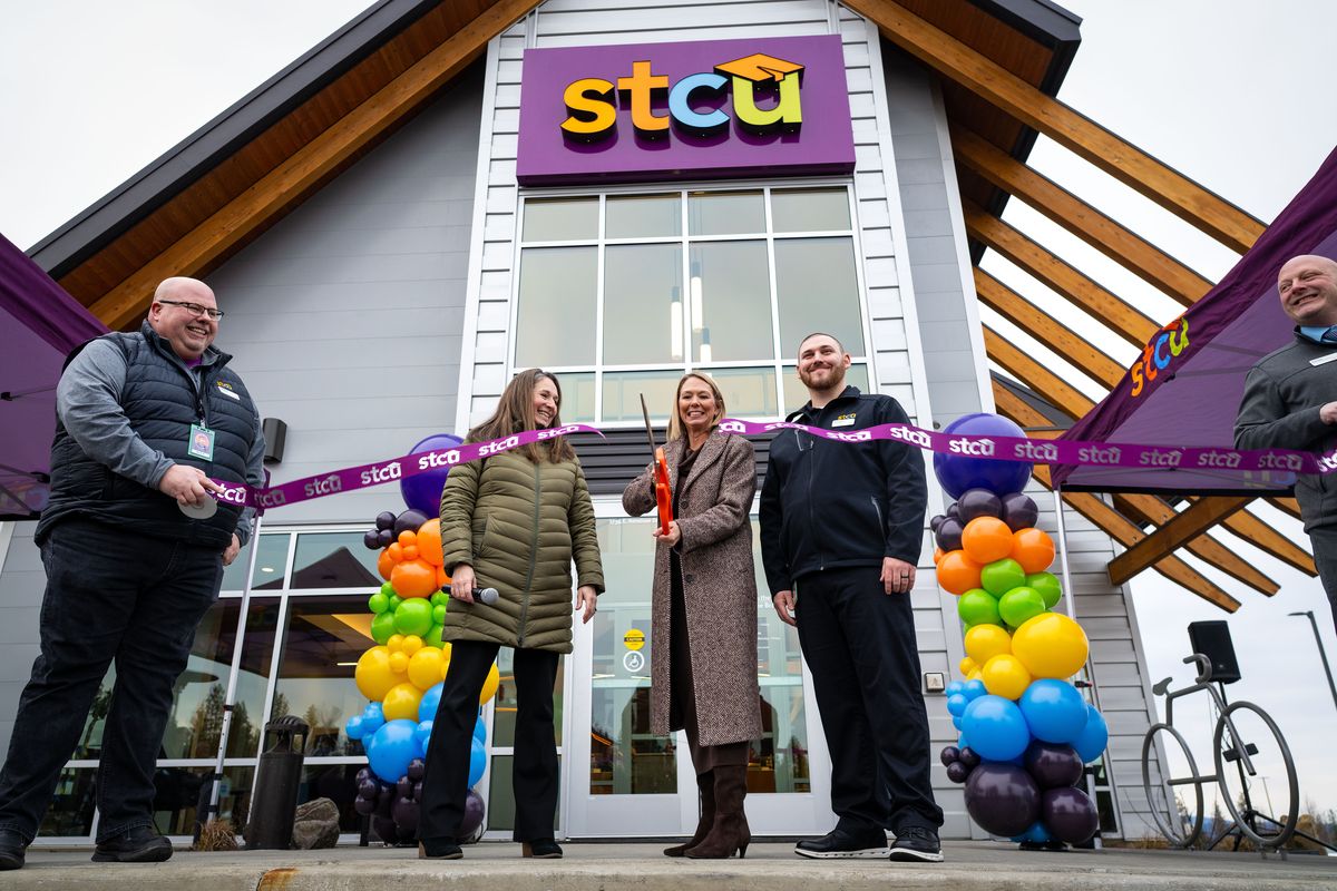 President and CEO of STCU Lindsey Myhre cuts the ribbon Wednesday during a dedication of the credit union’s 51st branch now open across from the Northside Costco. STCU has seen tremendous growth in the last five years.  (COLIN MULVANY /THE SPOKESMAN-REVIEW)