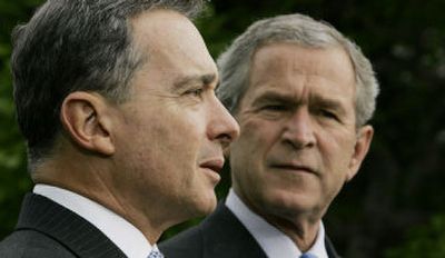 
President Bush and Colombian President Alvaro Uribe speak Wednesday after their meeting at the White House.
 (Associated Press / The Spokesman-Review)