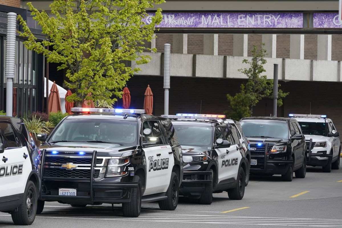 Police vehicles respond to a reported shooting, Saturday, May 1, 2021, at Southcenter Mall in Tukwila, Wash., south of Seattle.  (Ted S. Warren)