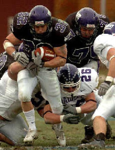 Wisconsin-Whitewater running back Justin Beaver pushes through Mount Union's defense.
(Associated Press / The Spokesman-Review)