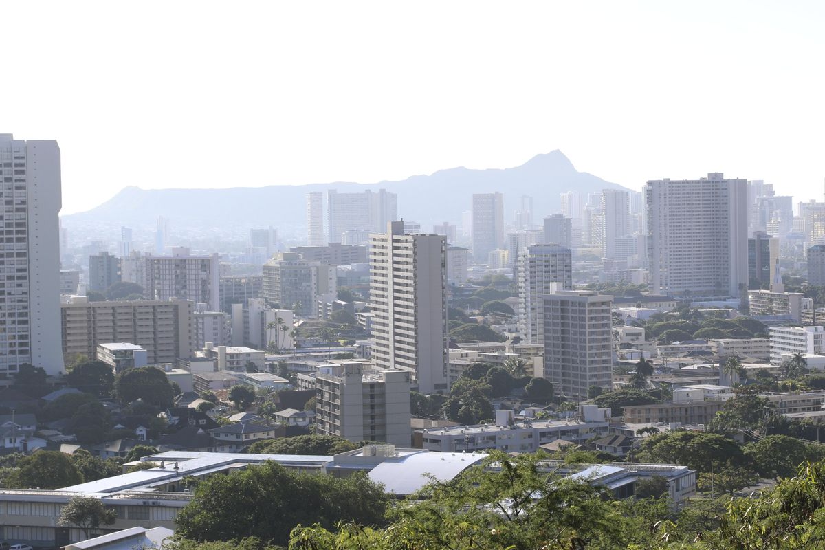 Diamond Head, an extinct volcanic crater, and high-rises are seen in Honolulu on Saturday, Jan. 13, 2018. A push alert that warned of an incoming ballistic missile to Hawaii and sent residents into a full-blown panic was a mistake, state emergency officials said. (Audrey McAvoy / AP)