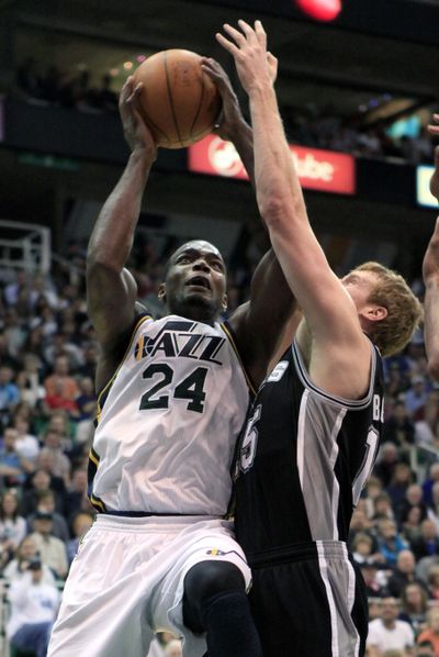 Utah Jazz forward Paul Millsap attempts a shot while defended by San Antonio Spurs forward Matt Bonner. (Associated Press)