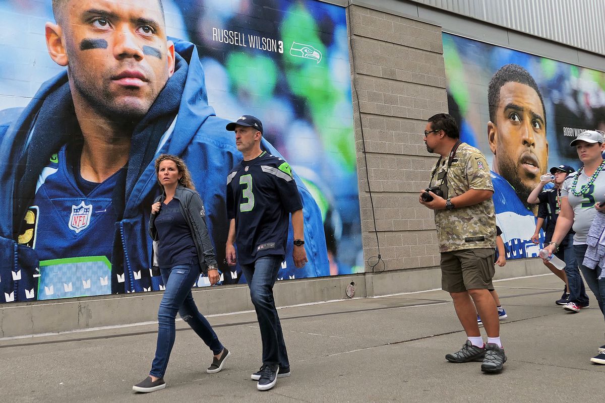 Fans walk toward the entrance to CenturyLink Field prior to the Seahawks-Raiders game on Aug. 28 in Seattle.
 (John Nelson)