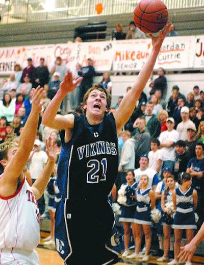 
Austin Heleker scored 11 points to help Coeur d'Alene beat Post Falls and clinch the IEL championship. 
 (Jesse Tinsley / The Spokesman-Review)