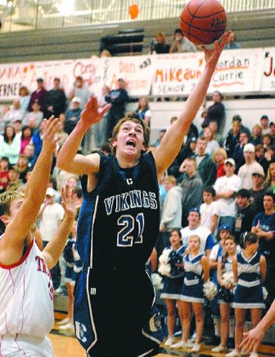 Austin Heleker scored 11 points to help Coeur d'Alene beat Post Falls and clinch the IEL championship.
(Jesse Tinsley / The Spokesman-Review)