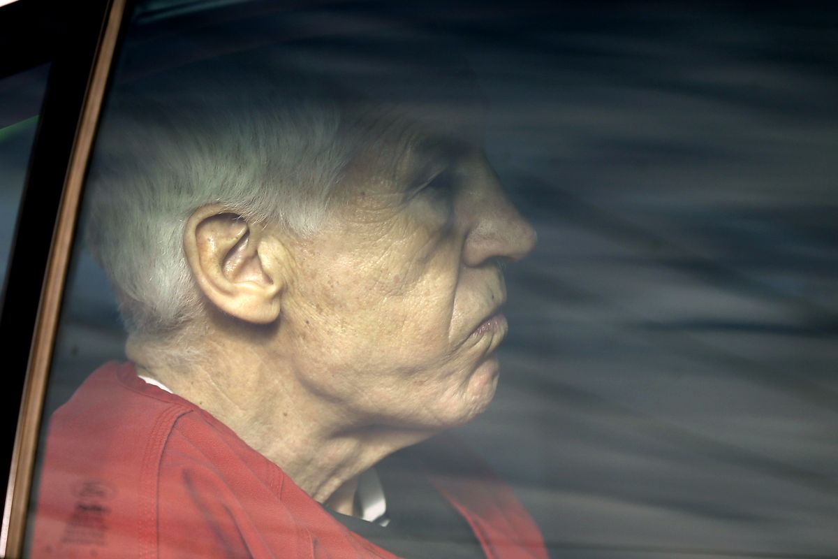 Former Penn State University assistant football coach Jerry Sandusky is driven from the Centre County Courthouse after being sentenced in Bellefonte, Pa., Tuesday, Oct. 9, 2012. Sandusky was sentenced to at least 30 years in prison, effectively a life sentence, in the child sexual abuse scandal that brought shame to Penn State and led to coach Joe Paterno's downfall. (Matt Rourke / Associated Press)
