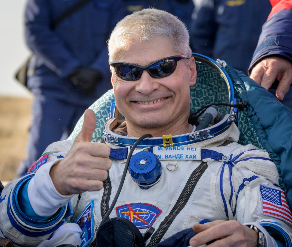 NASA astronaut Mark Vande Hei gives the thumbs up outside the Soyuz MS-19 spacecraft after he landed with Russian cosmonauts Anton Shkaplerov and Pyotr Dubrov in a remote area near the town of Zhezkazgan, Kazakhstan on Wednesday, March 30, 2022. Vande Hei and Dubrov are returning to Earth after logging 355 days in space as members of Expeditions 64-66 aboard the International Space Station.  (Bill Ingalls)