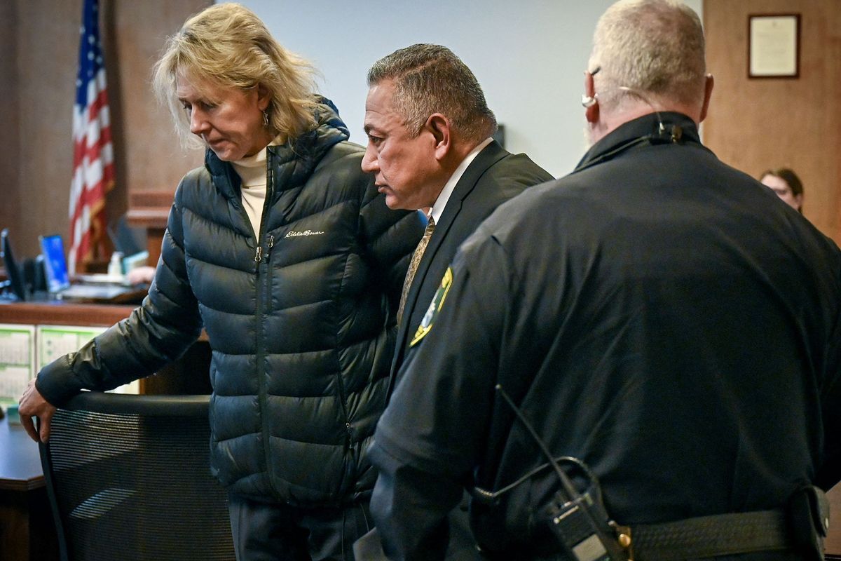 Richard Aguirre, 59, center,,is led out of court after being convicted, Tuesday, Dec. 26, 2023, for the 1986 killing of Ruby Doss, 27. Judge Jeremey Schmidt ruled Aguirre guilt of first-degree murder. Attorney Karen Lindholdt is at left.  (DAN PELLE/THE SPOKESMAN-REVIEW)