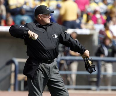 Umpire Rick Reed is rehabbing by working in the minor leagues after suffering two strokes.  (Associated Press / The Spokesman-Review)