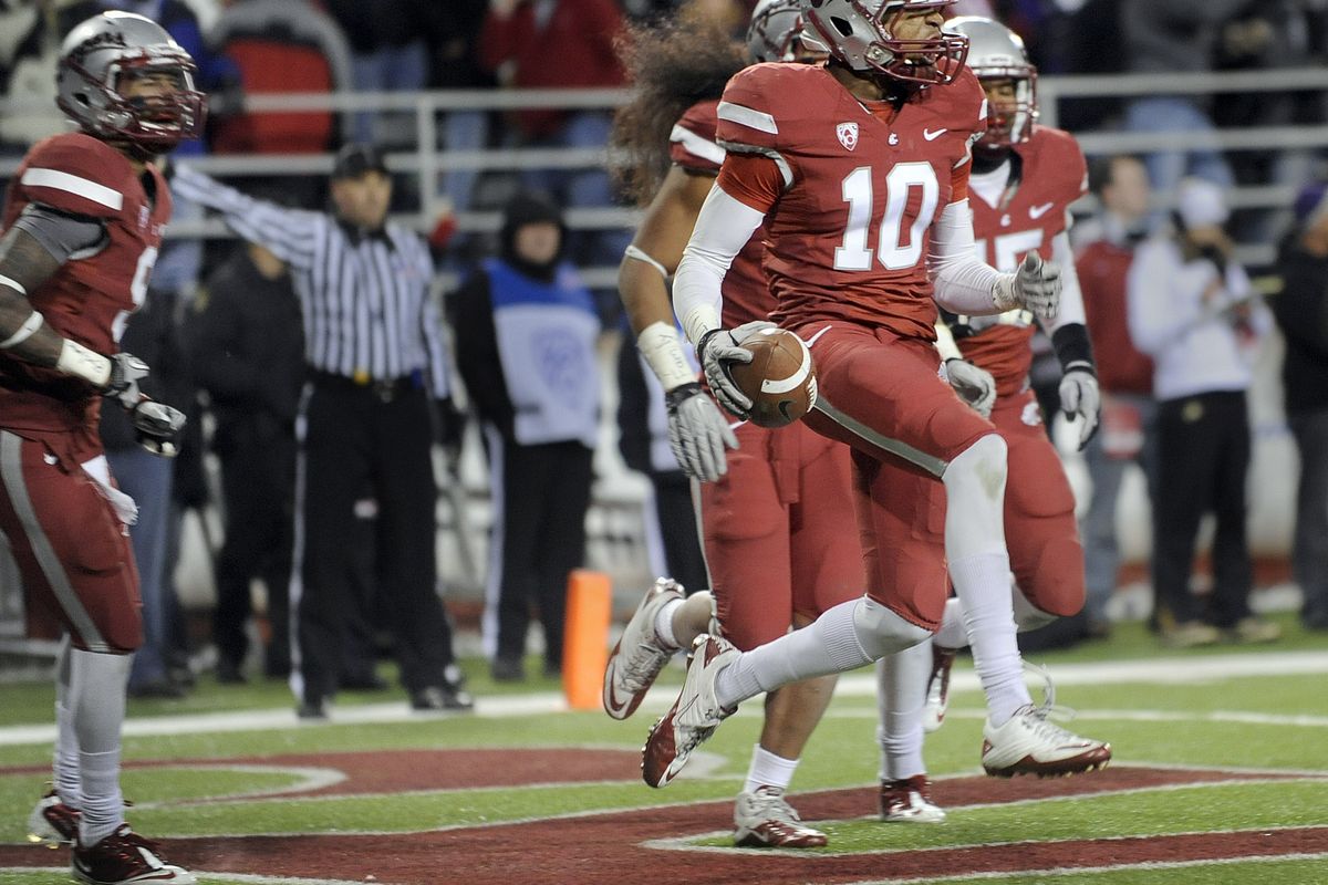 WSU defensive back Deone Bucannon (10) celebrates a crucial interception near the end of the first half on Saturday. (Christopher Anderson)