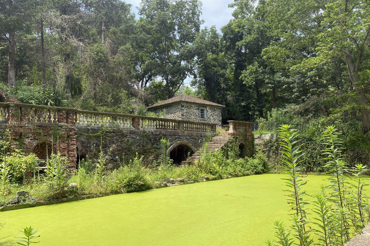 The Lower Pool, with its surreal green glow of duckweed, is a pond terrace that conveys the charm and mystique of a garden built between the world wars by a du Pont heiress and her Boston Brahmin husband.  (Adrian Higgins/Washington Post)