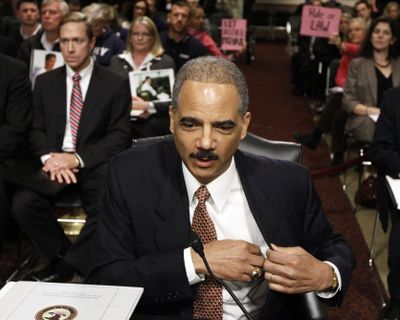 Attorney General Eric Holder takes his seat  prior to testifying before the Senate Judiciary Committee.  (Associated Press)