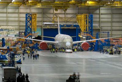 
A 787 Dreamliner comes out of Boeing's Everett Assembly Line in Everett, Wash. , on June 25. The plane was being taken to a nearby facility to be painted. Associated Press
 (Associated Press / The Spokesman-Review)